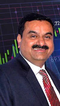 <i class="tbold">gautam adani</i> donates INR 10,000 Crores