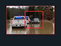 Caught on cam: Woman climbs out of car in flood waters