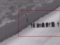 Video shows people using ladder to cross border