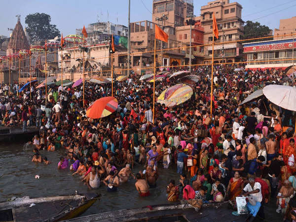 Kartik Purnima Photos Devotees Take Holy Dip In Ganga In Varanasi