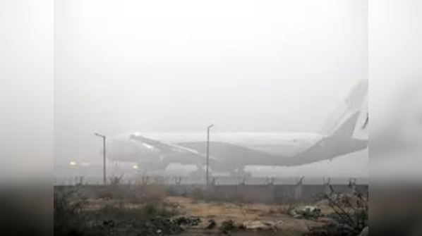 In Pics Dense Fog Disrupts Flights Trains In Delhi