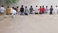 Watch: Locals form human chain to rescue washed away people in Indore