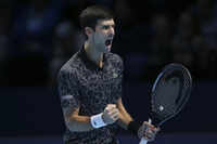 Novak Djokovic beats John Isner in ATP Finals opener