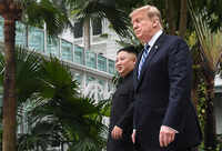 US President Donald Trump and North Korean leader Kim take a stroll on 2nd day of summit