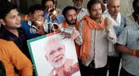 Bhopal: BJP workers perform ‘Dudh Abhishek’ of PM Modi’s poster ahead of his swearing-in ceremony