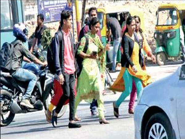 At Majestic & Byappanahalli, walkers risk life to access Metro stations