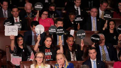 From ‘Musk Steals’ to ‘That’s a Lie’ - Here are all the protest signs and their meanings at Donald Trump’s address to Congress