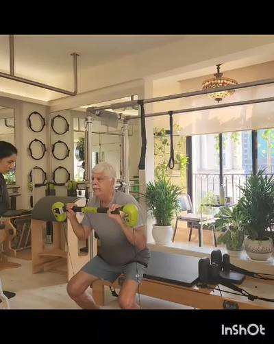 Dr RK Pathak does a few balance exercises at a pilates session with wellness coach Ruchi Kishore