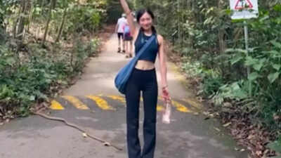 Watch: Oblivious hiker poses for photo as cobra silently moves past her