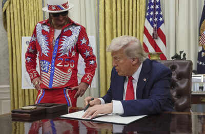 Joined by Kid Rock, Trump signs order to tackle ticket scalping