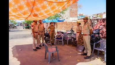 Police set up camp as locals protest