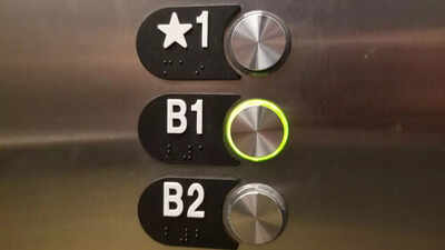 Why do some elevator buttons have a star symbol next to a floor?
