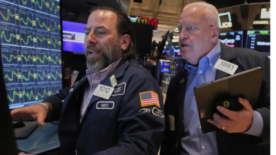Dollar plunges, stocks wobble over trade war turmoil
