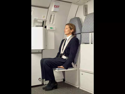 Ever wonder why flight attendants sit on their hands during takeoff and landing? Here's the real reason