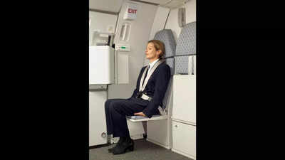 Ever wonder why flight attendants sit on their hands during takeoff and landing? Here's the real reason