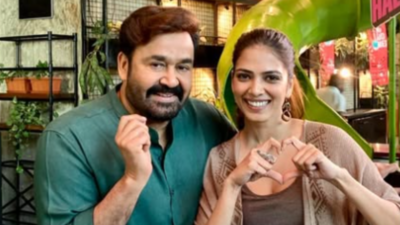 Mohanlal makes a cute pose as Malavika Mohanan shares adorable pic from 'Hridayapoorvam' sets