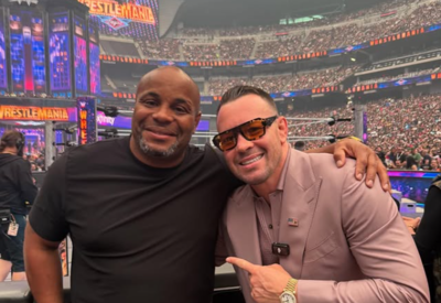 Colby Covington mocks Jon Jones while sitting ringside with Daniel Cormier at WrestleMania 41
