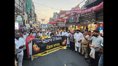 AAP MLAs take out candle light march against attack, demand action from Centre