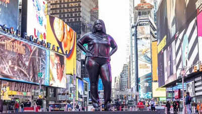 Americans are raging over the 12-foot-tall woman sculpture installed in Times Square, here's why
