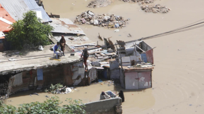 At least seven people die as heavy rains leave waist-high floodwaters in Somalia's capital