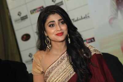 Shriya Saran walks the ramp at a fashion show in Bengaluru