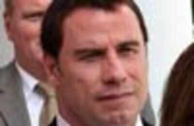 Travolta hates watching wife's sex scenes