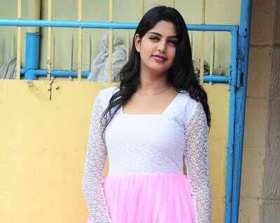 Model Navamy sizzled in a pink flawless gown at a film pooja in Trivandrum