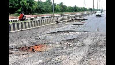A road riddled with potholes & apathy