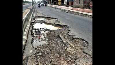A road riddled with potholes & apathy