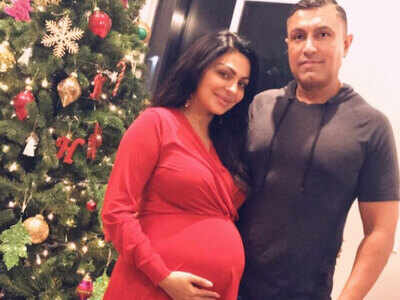 Neeru Bajwa flaunts her baby bump in a beautiful red dress