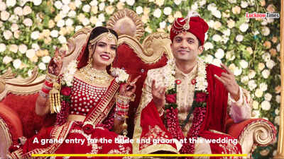 A grand entry by the bride and groom at this wedding