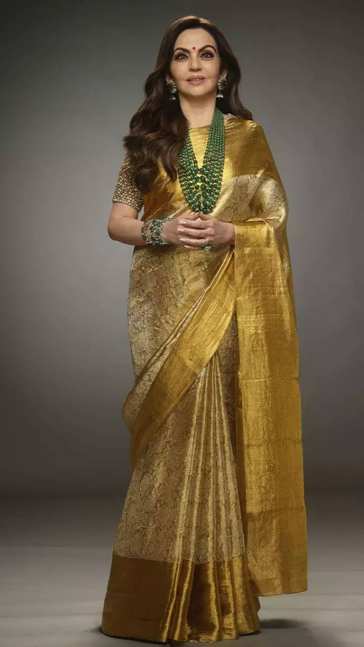 Shatika - Online Handloom Saree Store - Nita Ambani looks ravishing wearing  a pink chiffon saree with a yellow border. We at Shatika admire her  penchant for sarees and the ease with