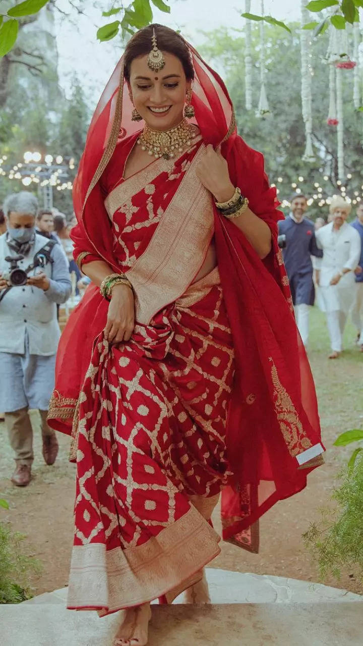 A portrait of a 27 year old Bangladeshi muslim women wearing saree,Veil on  the head, saree color is solid, simple eyelyshe in her eye, standing middle  of a jungle road - SeaArt