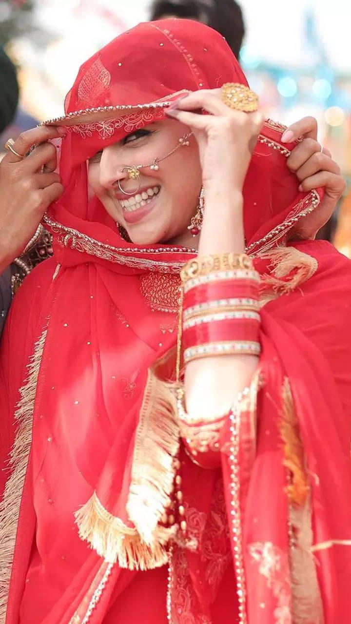 nimrat khaira red suit