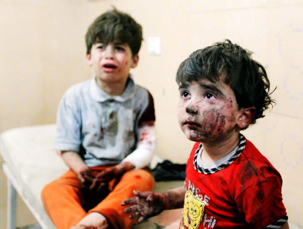 Injured children cry after, according to activists, two barrel bombs were thrown by forces loyal to Syria's president Bashar Al-Assad in Hullok neighbourhood of Aleppo. (REUTERS/Jalal Al-Mamo) 