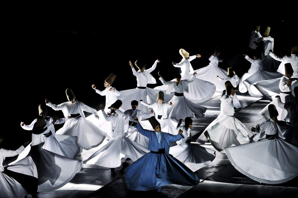 Whirling dervishes perform at the Maltepe Stadium in Istanbul on the eve of Ramzan. The dervishes are adepts of Sufism, a mystical form of Islam that preaches tolerance and a search for understanding. Those who whirl, like planets around the sun, turn dance into a form of prayer. (AFP PHOTO/OZAN KOSE)