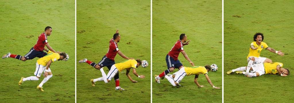 Things fall apart: Zunigo collides with Neymar during Brazil-Colombia match