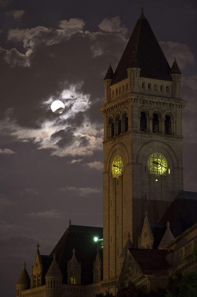 This picture provided by Nasa shows a perigree full moon or supermoon over the Old Post Office and Clock Tower in Washington. (AFP PHOTO/NASA/Bill Ingalls/HO)