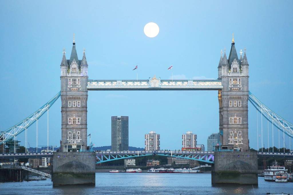 A supermoon rises over Tower Bridge in London. (REUTERS/Paul Hacket) 