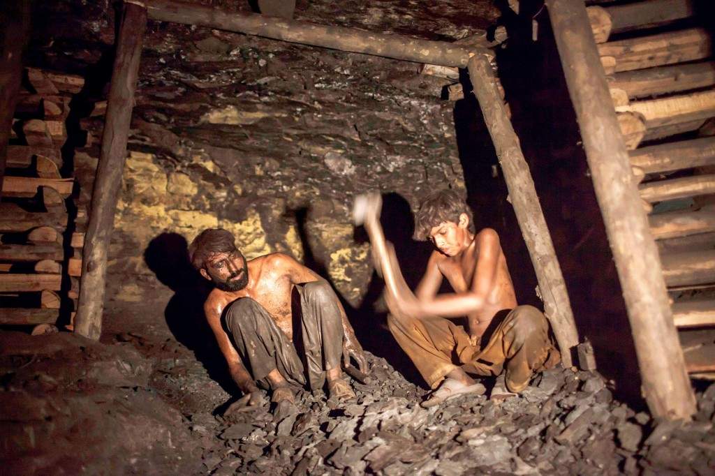 Samiullah breaks coal inside a mine in Choa Saidan Shah, Punjab province