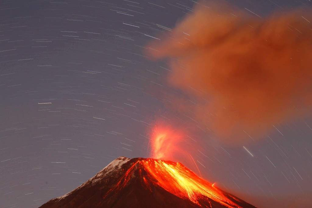 The Tungurahua volcano throws ash and stones during an eruption seen from Banos, Ecuador. (AP Photo/Dolores Ochoa)