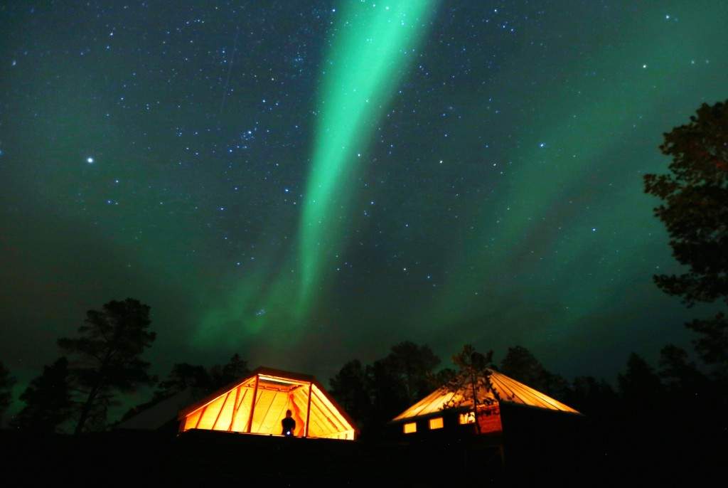 The Aurora Borealis (Northern Lights) is seen over a mountain camp north of the Arctic Circle, near the village of Mestervik