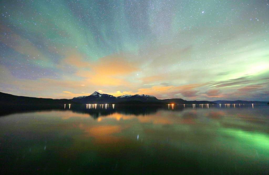 Tthe Aurora Borealis (Northern Lights) is seen over the Bals-Fiord near the village of Mestervik, north of the Arctic Circle