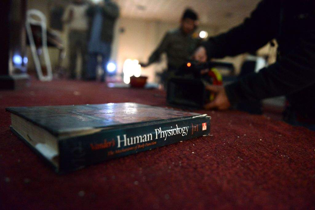 A school text book lies on the carpet at an army-run school a day after an attack by Taliban militants in Peshawar. (AFP PHOTO / A MAJEED)