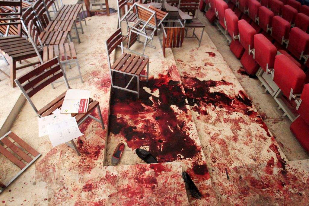 Shoes lie in blood on the auditorium floor at the Army Public School, which was attacked by Taliban gunmen, in Peshawar. (REUTERS/Fayaz Aziz)