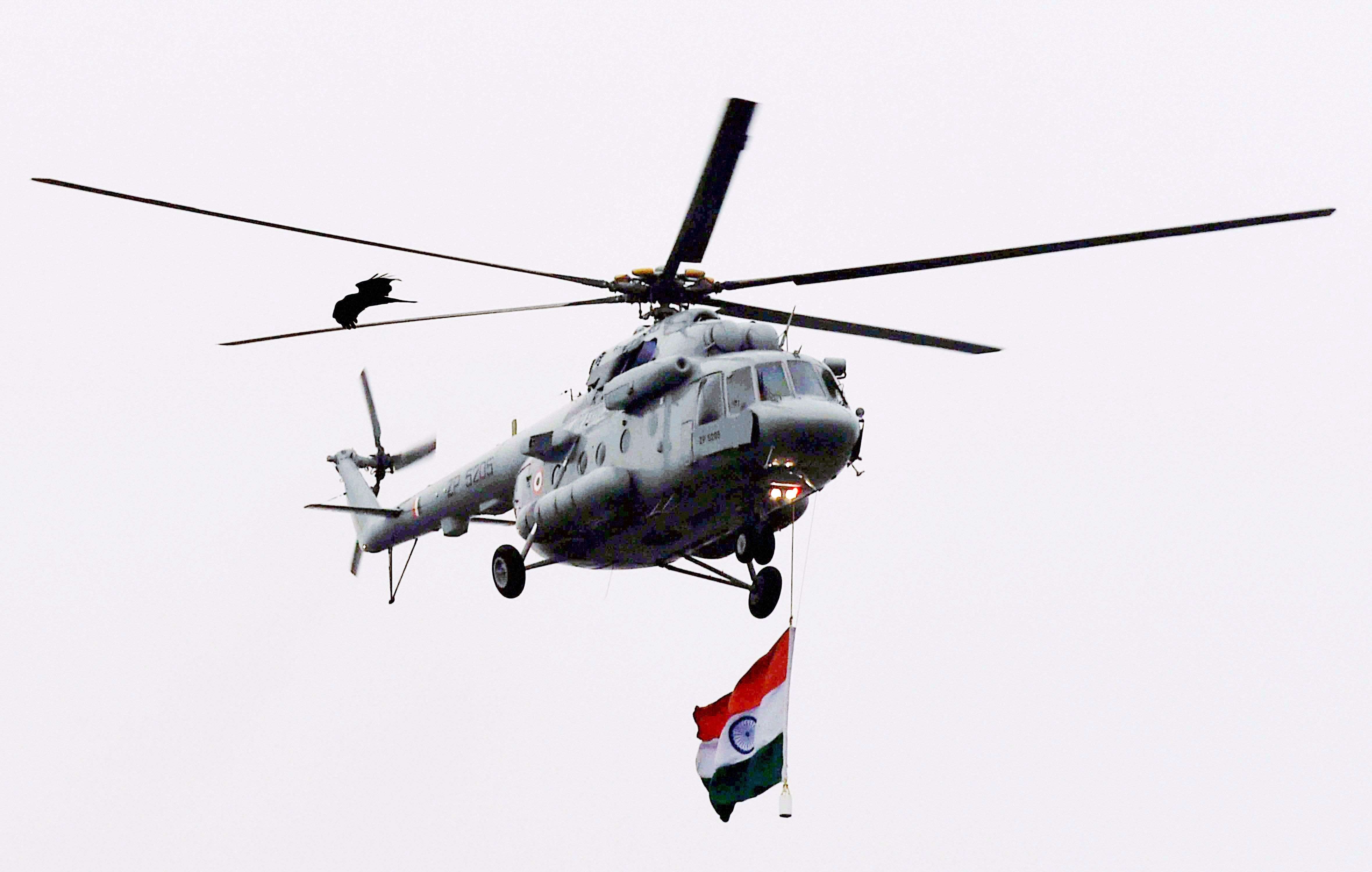 An Army helicopter fly past during the rehearsal for the Republic Day parade at Rajpath in New Delhi. (PTI photo by Atul Yadav)
