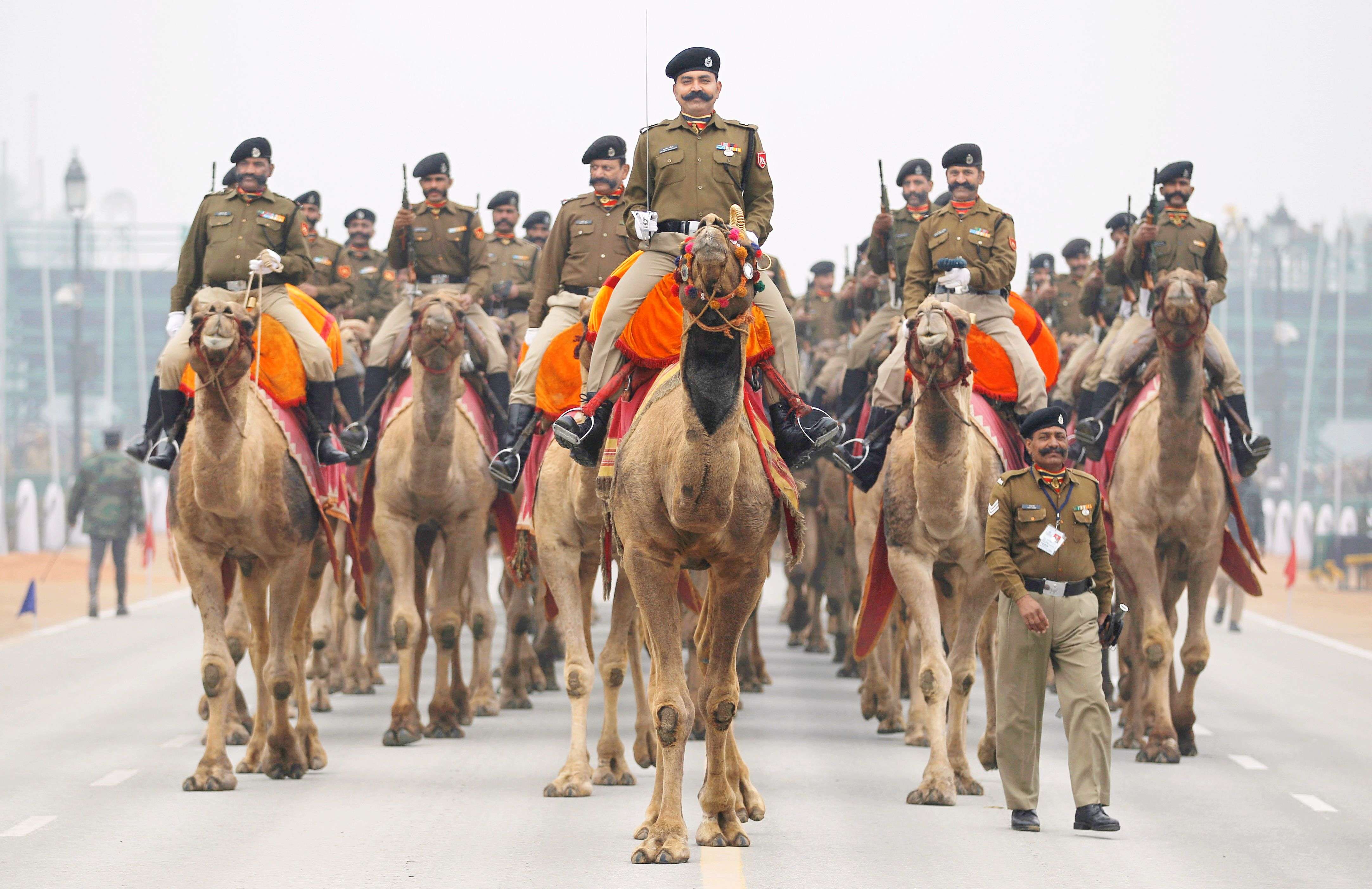 Camel mounted Border Security Force soldiers ride during rehearsals for the upcoming Republic Day parade in New Delhi. (AP Photo/AltafC Qadri)