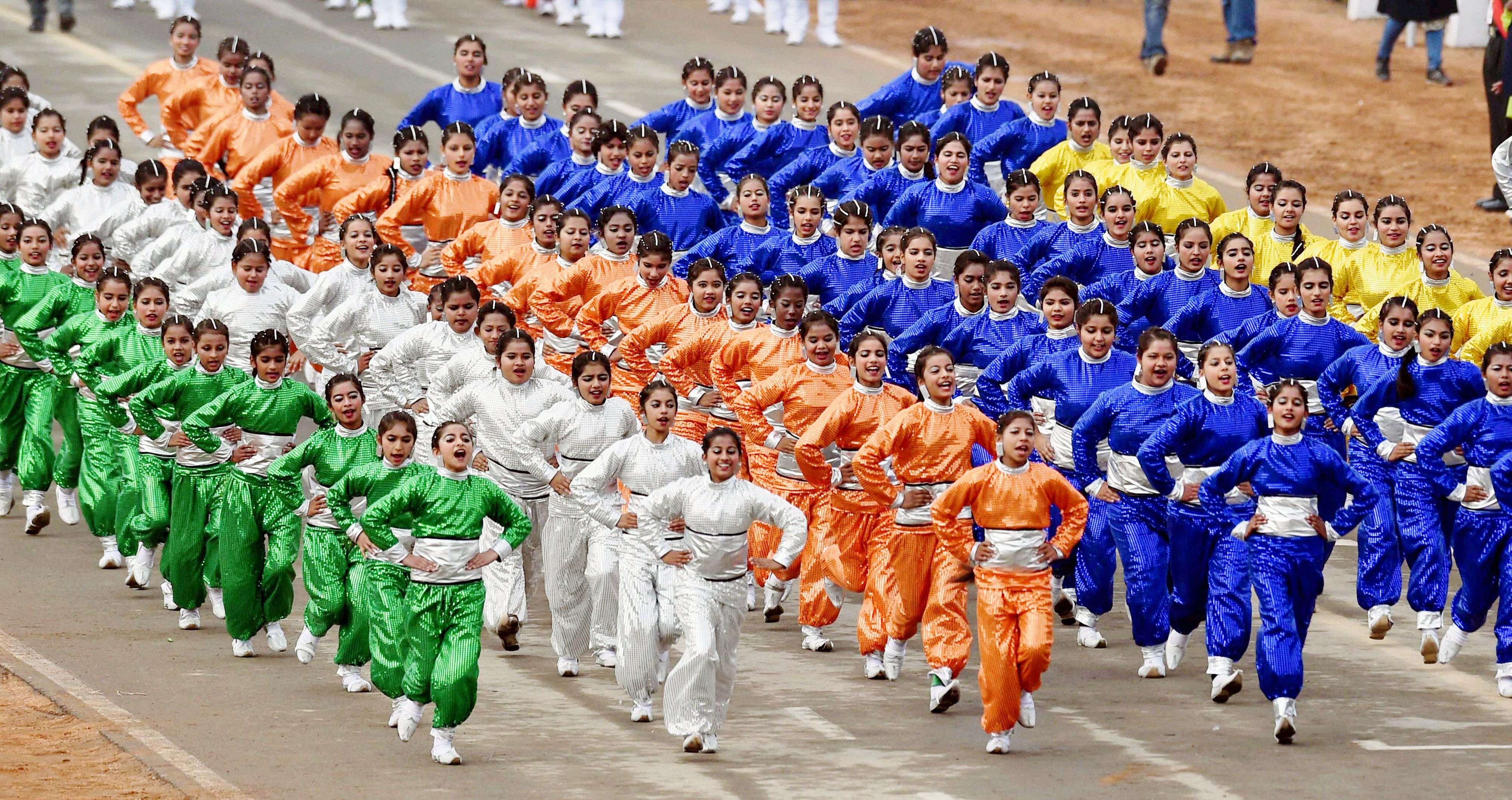 School children perform during the full dress rehearsal for the Republic Day parade at Rajpath in New Delhi. (PTI photo by Atul Yadav)