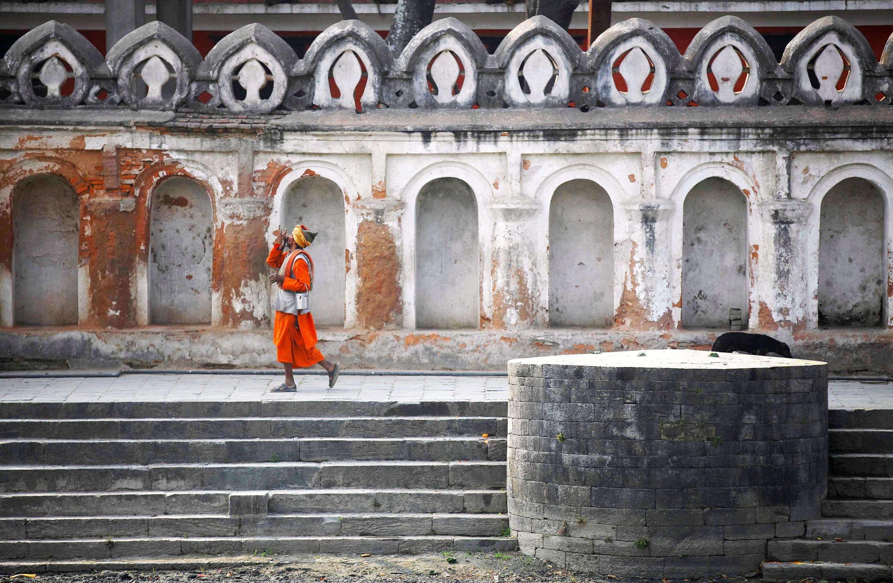 A sadhu walks along the premises of Pashupatinath Temple in Kathmandu. (REUTERS/Navesh Chitrakar)