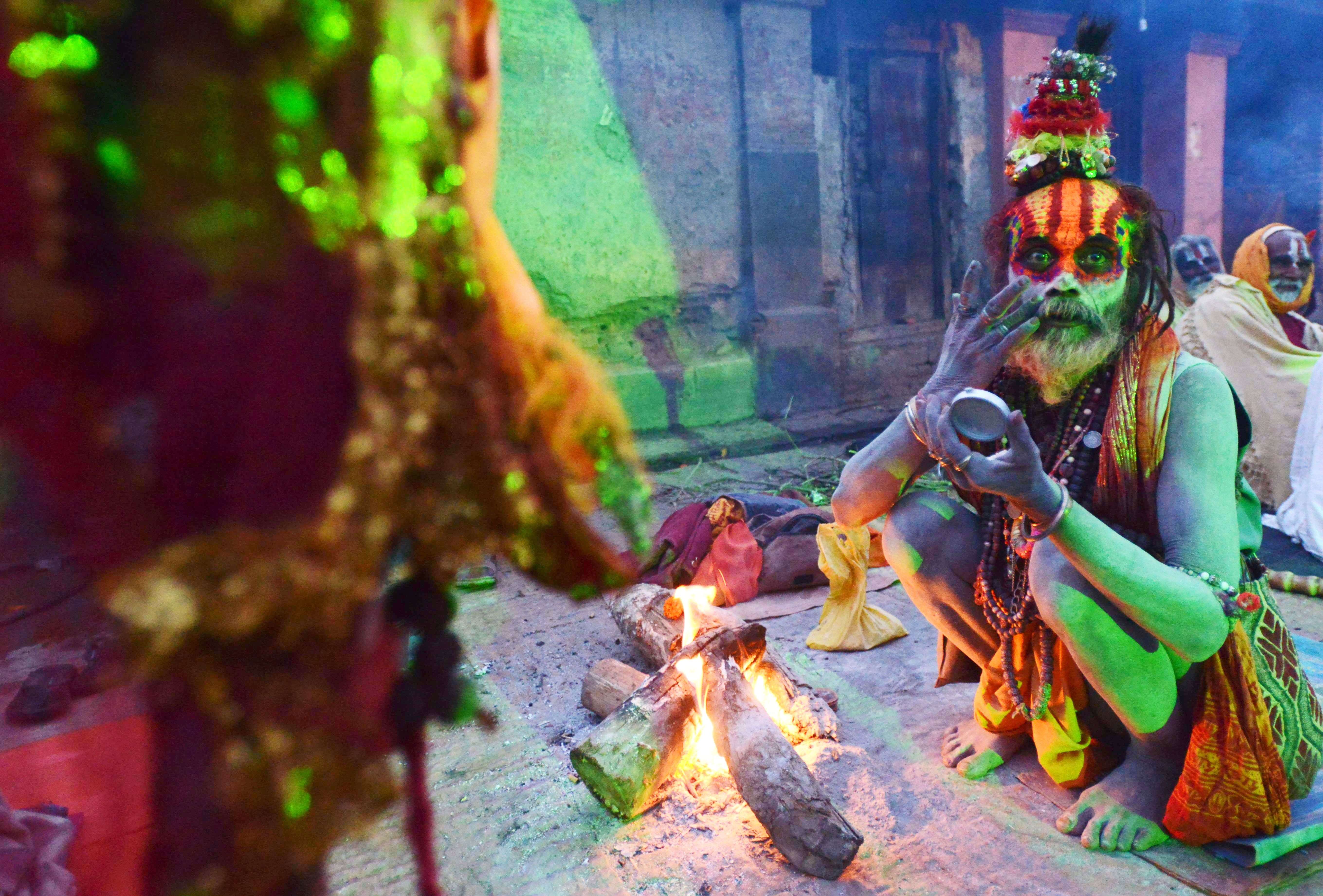 A sadhu paints coloured paste onto his face during the Maha Shivaratri festival in Kathmandu. (AFP PHOTO / PRAKASH MATHEMA)